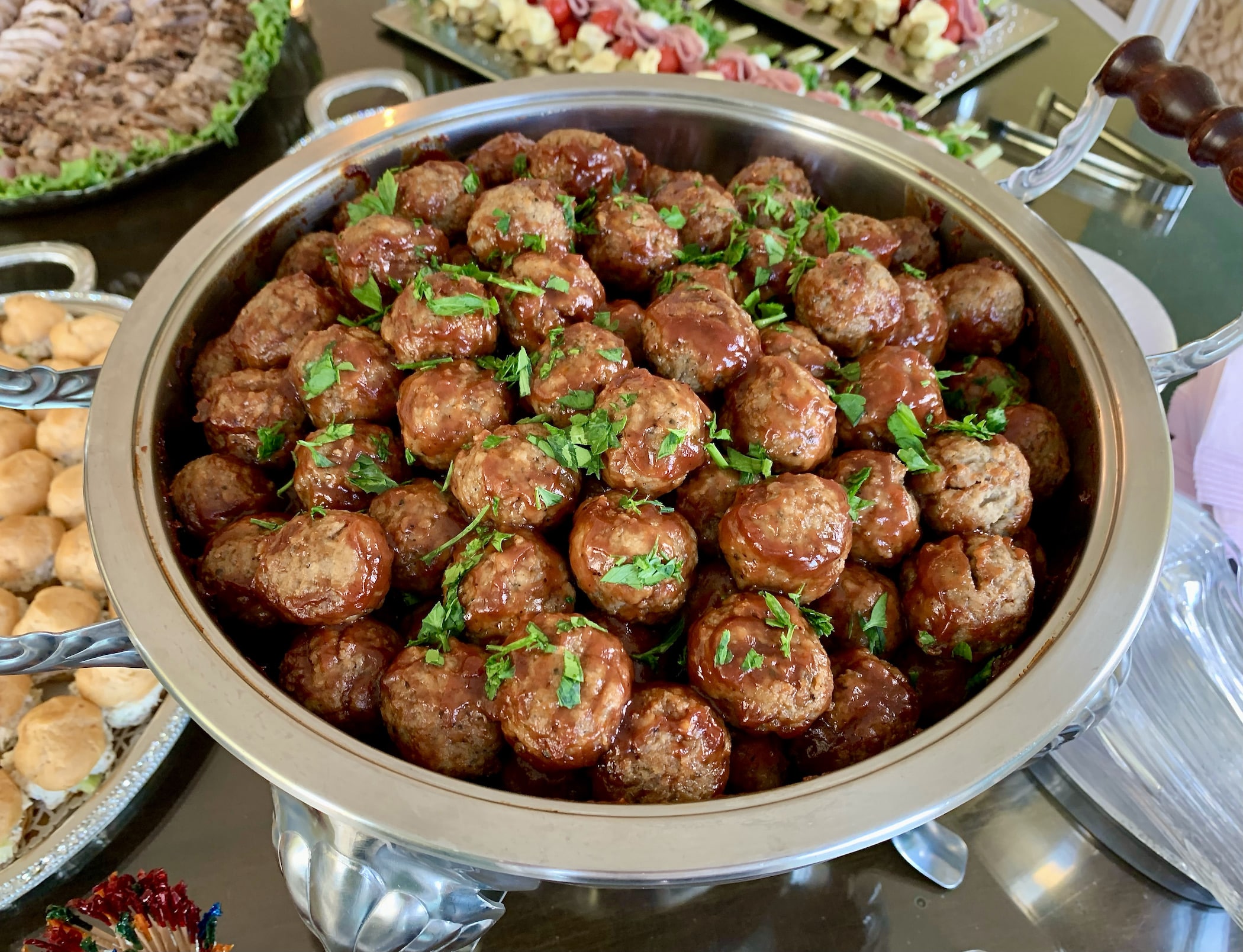 Herb-seasoned beef meatballs roasted in tangy barbeque sauce. Served warm with party picks.