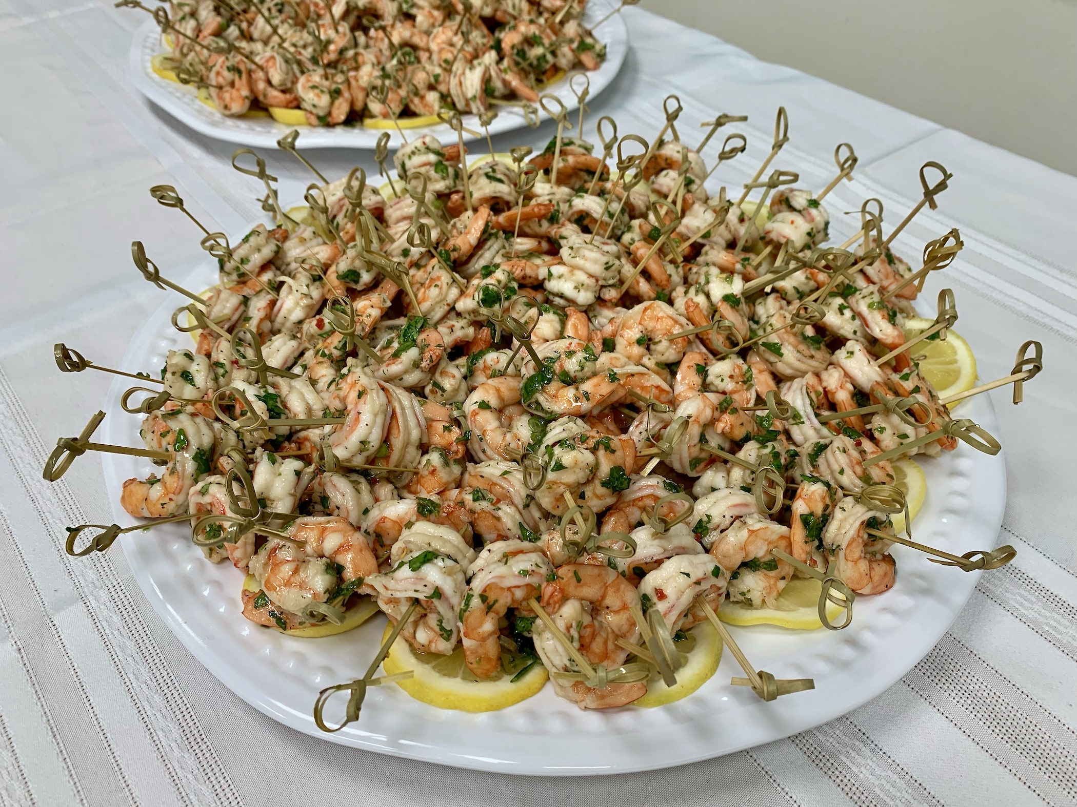 Zesty Marinated Shrimp, Southern-Style Pickled Shrimp or Marinated Shrimp and Artichoke Hearts served on a skewer.