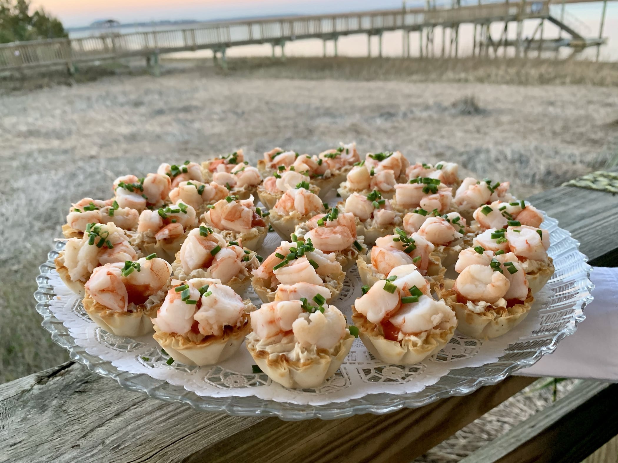 Phyllo tartlets filled with seasoned cream cheese, classic cocktail sauce and topped with shrimp.