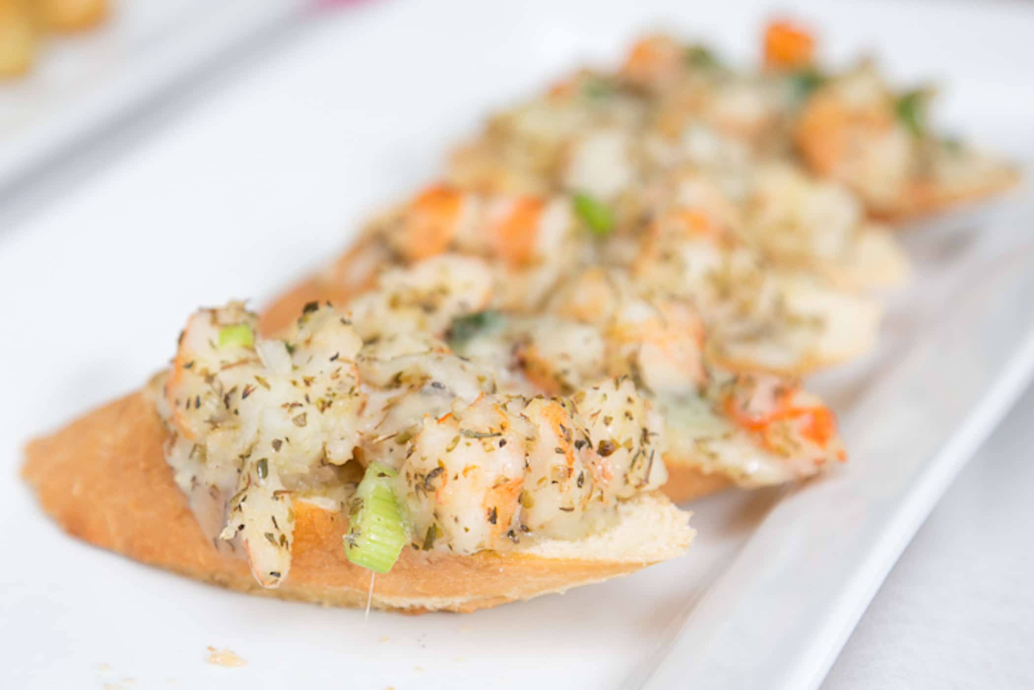 Fresh shrimp seasoned with garlic and fresh herbs teamed with Mozzarella cheese and served warm on a sliced French baguette.