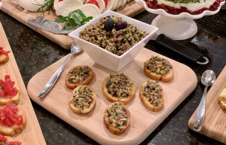 Green, black and kalamata olives teamed with herbs, garlic and capers. Served with crosini or cocktail crackers.