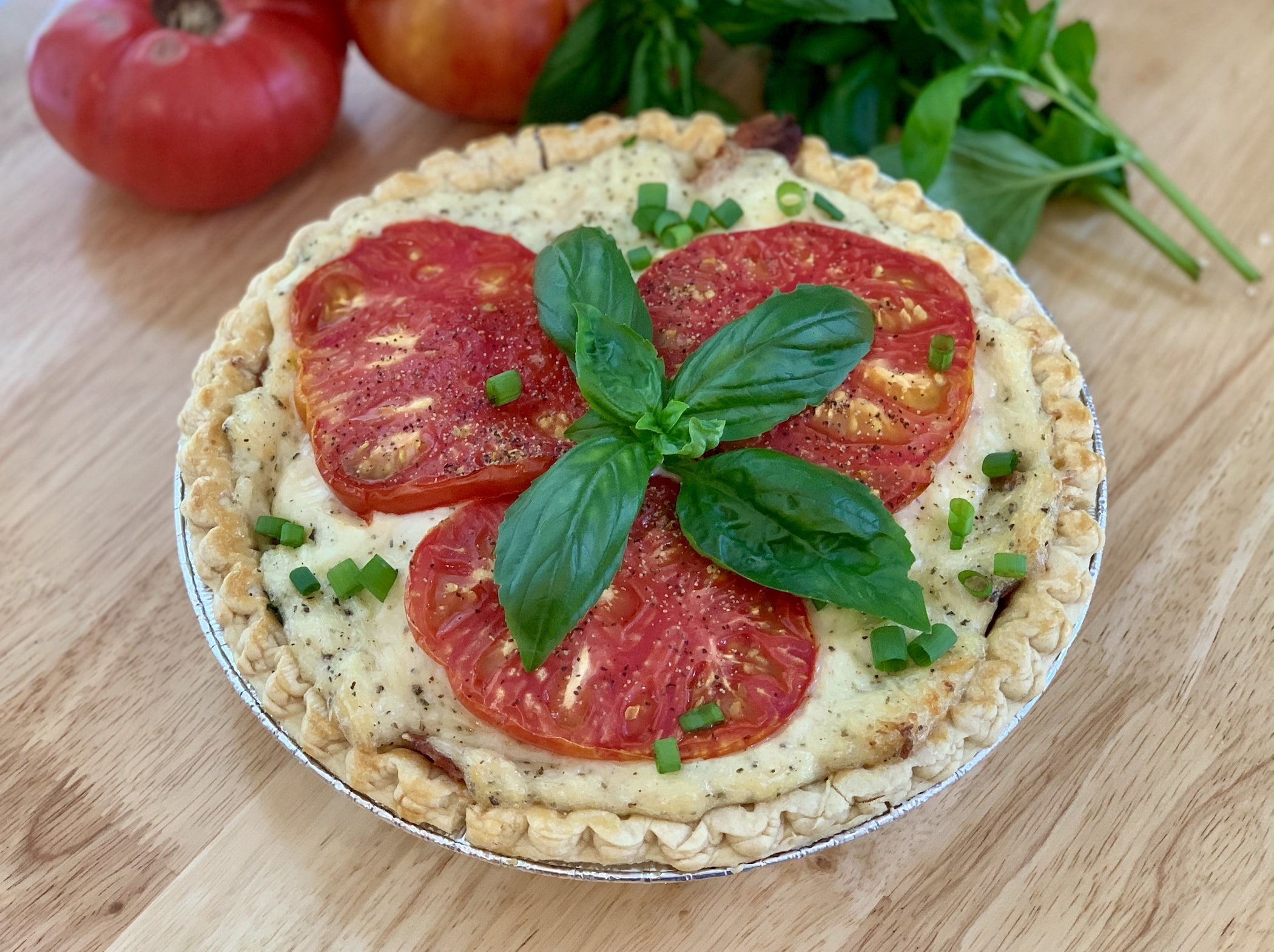 Flaky pastry crust loaded with fresh tomatoes, basil and cheese.
